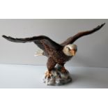 A Beswick Bald Eagle figurine on a stylized base in good condition without damage or repair, 17 x