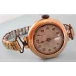 An early 20th century lady's 9ct gold-cased wristwatch with Swiss movement, silvered dial with