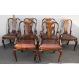 A set of four late 19th century walnut dining chairs with two matching carvers, urn-shaped splats,