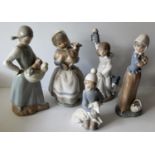 A Lladro figurine of a young girl holding a lamb, four NAO figurines of girls holding dogs / cats
