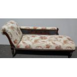 A Victorian mahogany framed upholstered chaise longue with recently recovered fabric and Algerian