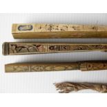 Three 19th century Oriental fans, two of carved ivory, the other of wood all in need of