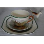 A Copeland Spode cup 'First Over', saucer 'Full Cry' and plate 'The Meet' with a Beswick beagle (4)