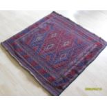 A Tajikistan hand-knotted tribal Gazak blue-ground rug with multicoloured isometric designs,