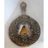 A Victorian-design floral embossed silver plated hand mirror