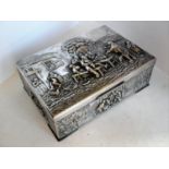 A silver plated, wood-lined oblong desk or jewellery box with embossed tavern scenes to lid and side