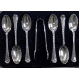 A George V cased set of six silver coffee spoons and sugar tongs by Josiah Williams & Co., London