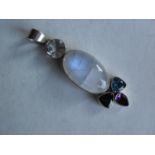 A striking .925 silver mounted pendant with large moonstone and various other gemstones