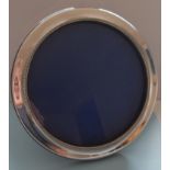 A Birmingham silver circular photo frame with gadroon rim on easel support by W I Broadway & Co,