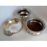 Two silver plated wine coasters and a planished circular bowl with applied handle (3)