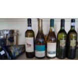 Six bottles of various white wine.