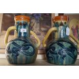 A pair of Belgium Art Pottery Arts & Crafts vases Each having two twisted handles, above incised