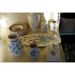 Eight pieces of Poole Pottery each having floral d