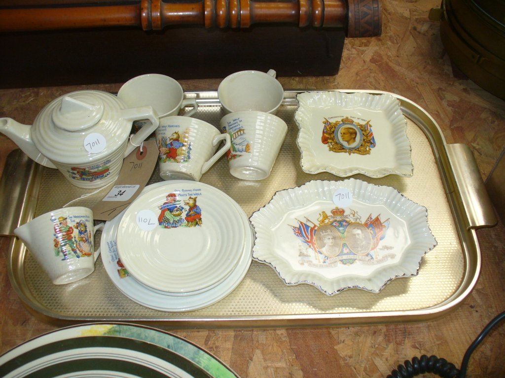 An Early 20th Century nursery tea set comprising a teapot with an angular handle , milk jug ,