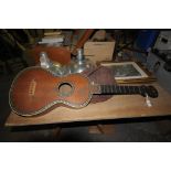 An Early 20th century acoustic guitar with an inla