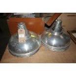 Four metal industrial type hanging light shades.