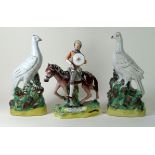 19th Century, three Staffordshire figures To include 'Don Quixote', height 24cm, a pair of pigeons,