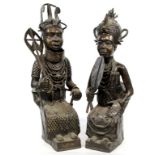 A pair of Nigerian 20th Century Benin bronze figures of a seated Oba Wearing elaborate head dress,