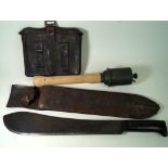 An American Legitimus machete dated 1943, complete with scabbard German stick grenade,
