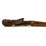 A Colonial carved wood walking stick late 19th/early 20th Century Stick with carved wood top with