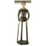 An unusual 19th Century Aunt Sally Raised on a painted wooden stand, with articulated arms,