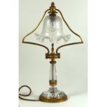 A cut glass and ormulu mounted French table lamp by H Beau early 20th Century The cut glass column