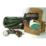 A police gas mask for nuclear and CS gas In box with descriptive label, box of assorted oil bottles,