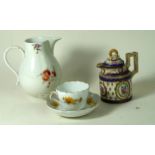 20th century Serves hand-painted porcelain jug and cover Decorated with a central roundels of roses,