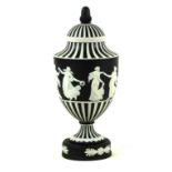 Wedgwood black and white Jasperware pedestal lidded urn vase Having relief decoration of Grecian