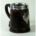 A white metal and leather mounted boot jack tankard 19th Century The rim with wavy edge,