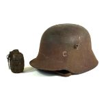 An Imperial German WWI period Infantry steel helmet The inside marked ET, 66,