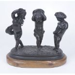 A late 19th Century Spelter figure group after Claude Michel Clodion The three cast putti holding
