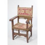 A 19th Century Elizabethan style hall elbow chair,