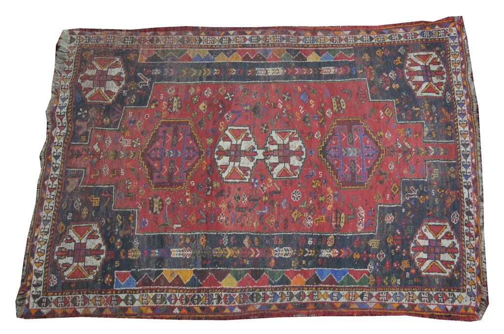 A Persian medallion rug Of rectangular form, the double stepped ivory lozenge centrally placed,