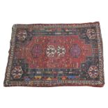 A Persian medallion rug Of rectangular form, the double stepped ivory lozenge centrally placed,