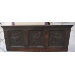 A 19th Century carved oak fire back The rectangular panel with three inset sections,