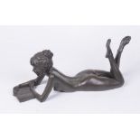 A bronze resin sculpture of a female figure Titled 'Anya with book',