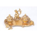 A French gilt metal Louis XVl style desk stand The scalloped and swept lower tray,
