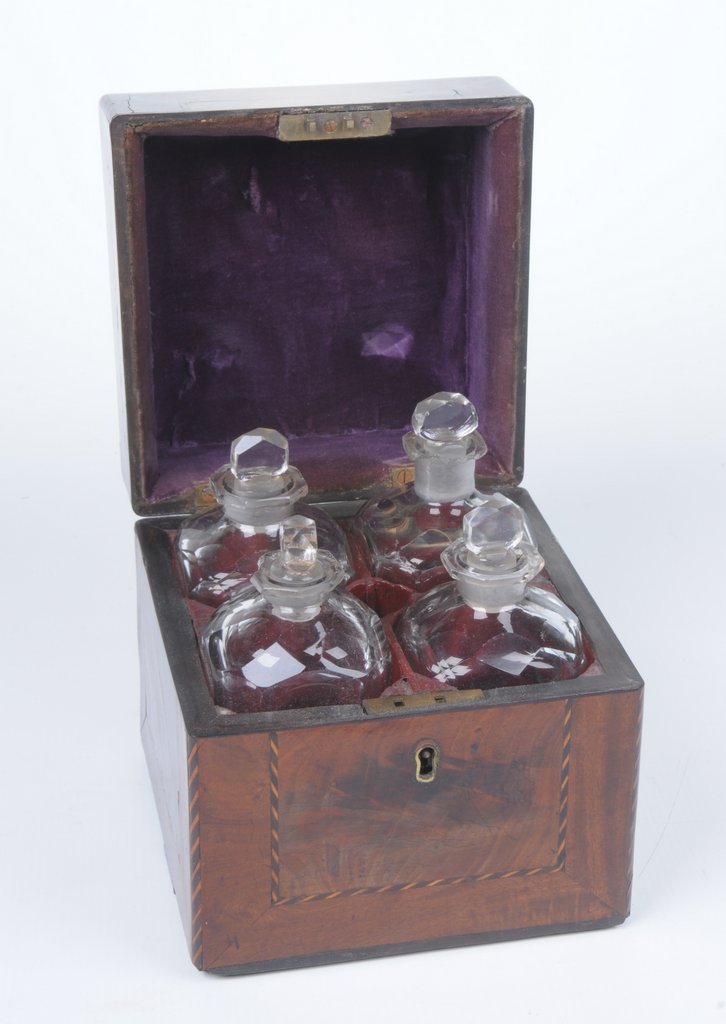 A 19th Century mahogany travelling liquor decanter box The square section box,