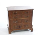 A Georgian style mahogany chest of drawers With a rectangular moulded top above four cockbeaded
