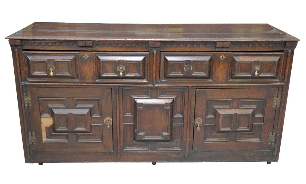 A 19th Century oak Jacobean style sideboard The rectangular moulded plank top above a pair of