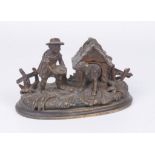 An unusual bronze inkwell desk stand,