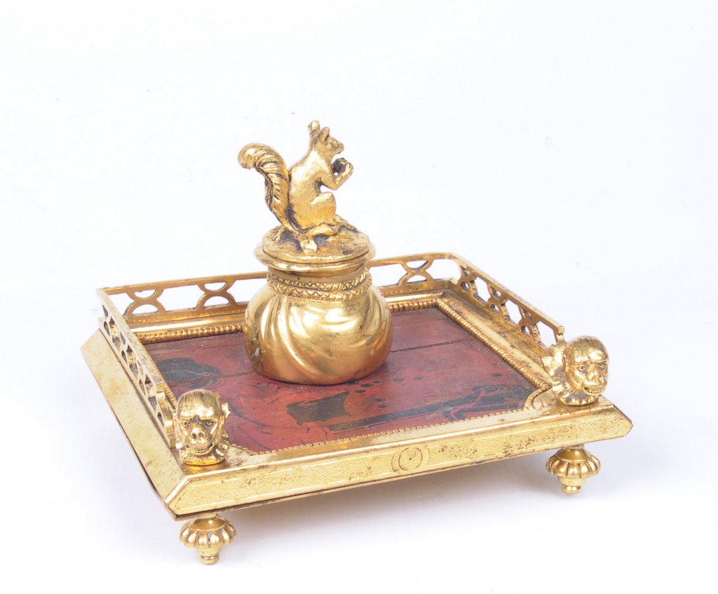 A French gilt metal ink stand, 20th Century The galleried square top with reticulated sides,