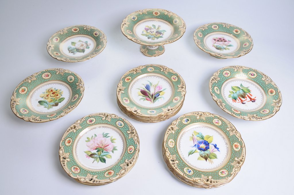 A 19th Century English porcelain dessert service Comprising a high comport rising from a swept