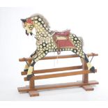 A dapple grey rocking horse The pine frame supporting the horse,