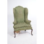 A Queen Anne and later wing back fireside armchair,