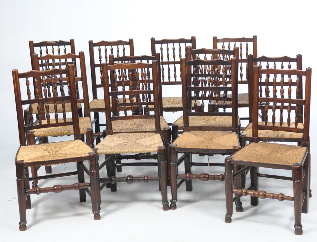 A harlequin set of twelve 19th Century Lancashire spindle back kitchen chairs,