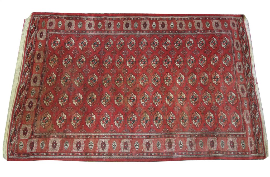 A Bokhara rug of typical rectangular form with central repeating geometric medallion design set