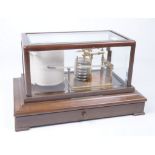 An early 20th Century Casella of London barograph The mahogany case with single shallow drawer,