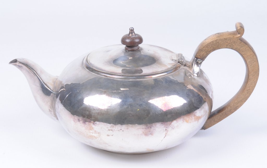 A Victorian silver presentation teapot Of squat circular form plain oval form,